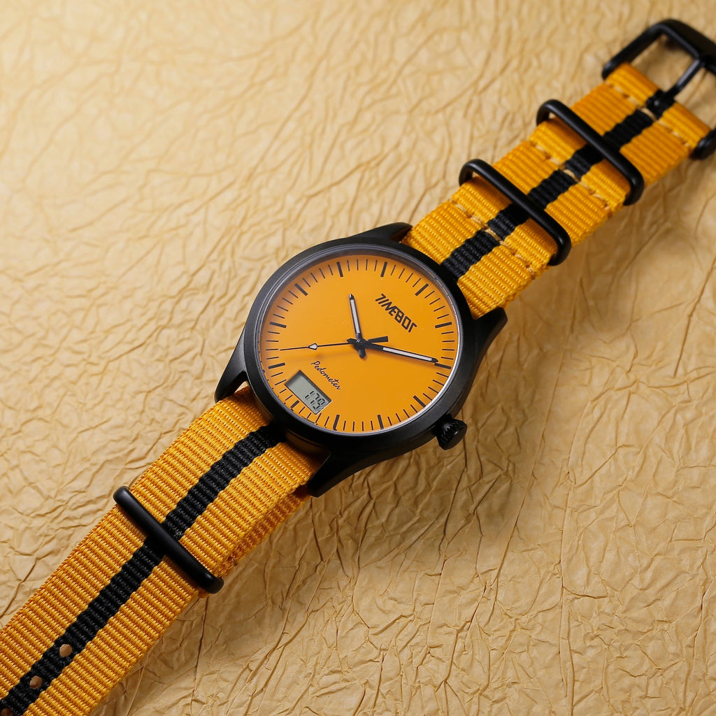 timebot t591c2 hybrid watch with yellow strap and orange face on a textured beige background