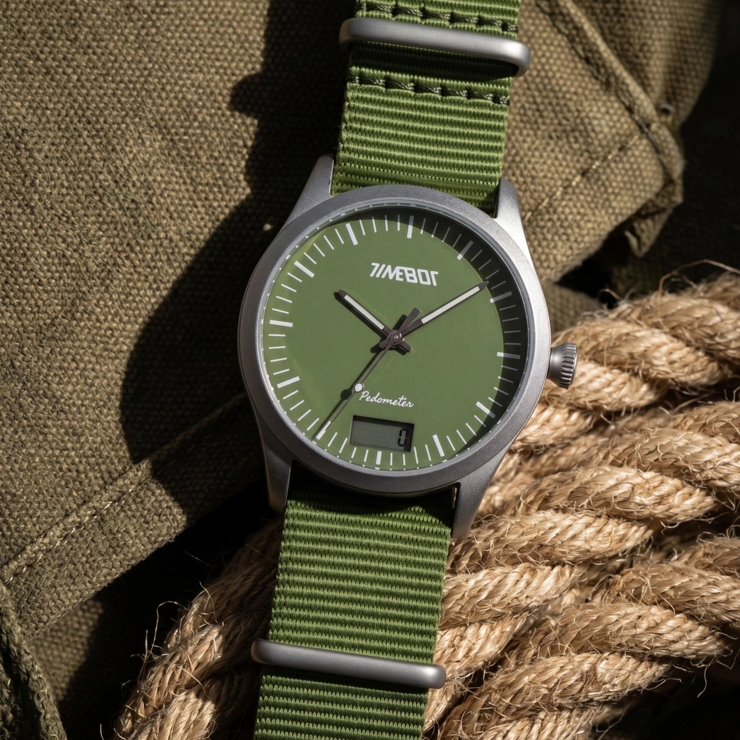 Timebot T591C4 Green pedometer watch with a green strap on a textured surface