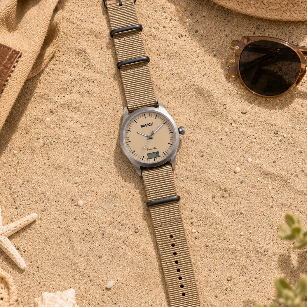 Timebot T591C6 hybrid Watch with a beige strap on a sandy surface with sunglasses and starfish.