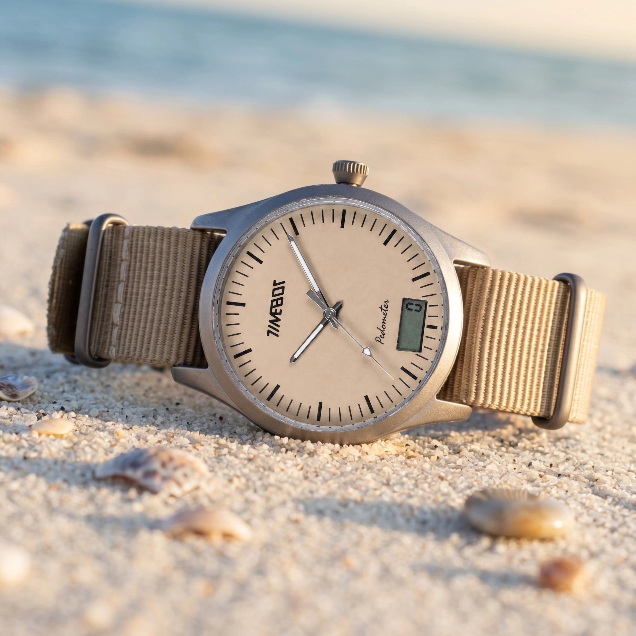Timebot standalone pedometer watch lying face up on hot desert sand