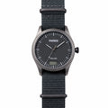 Black timebot hybrid watch with a digital step display on a white background
