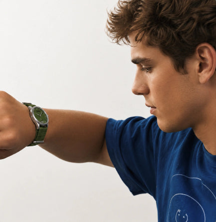 Man wearing a blue shirt and green Timebot T591C4 watch, looking at his steps on fitness watch