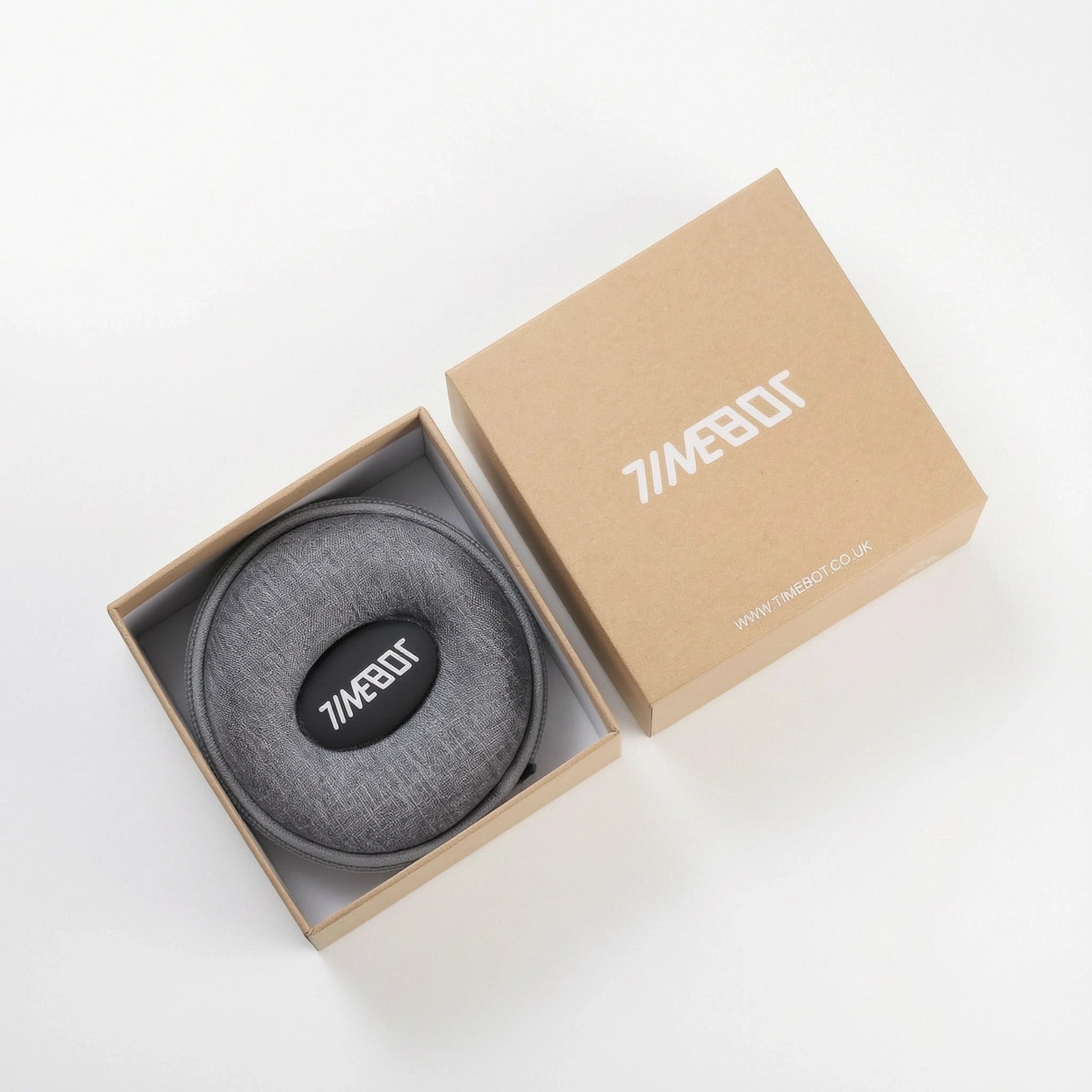 Open cardboard unboxing experience showing the secure Timebot zipper travel case inside the packaging